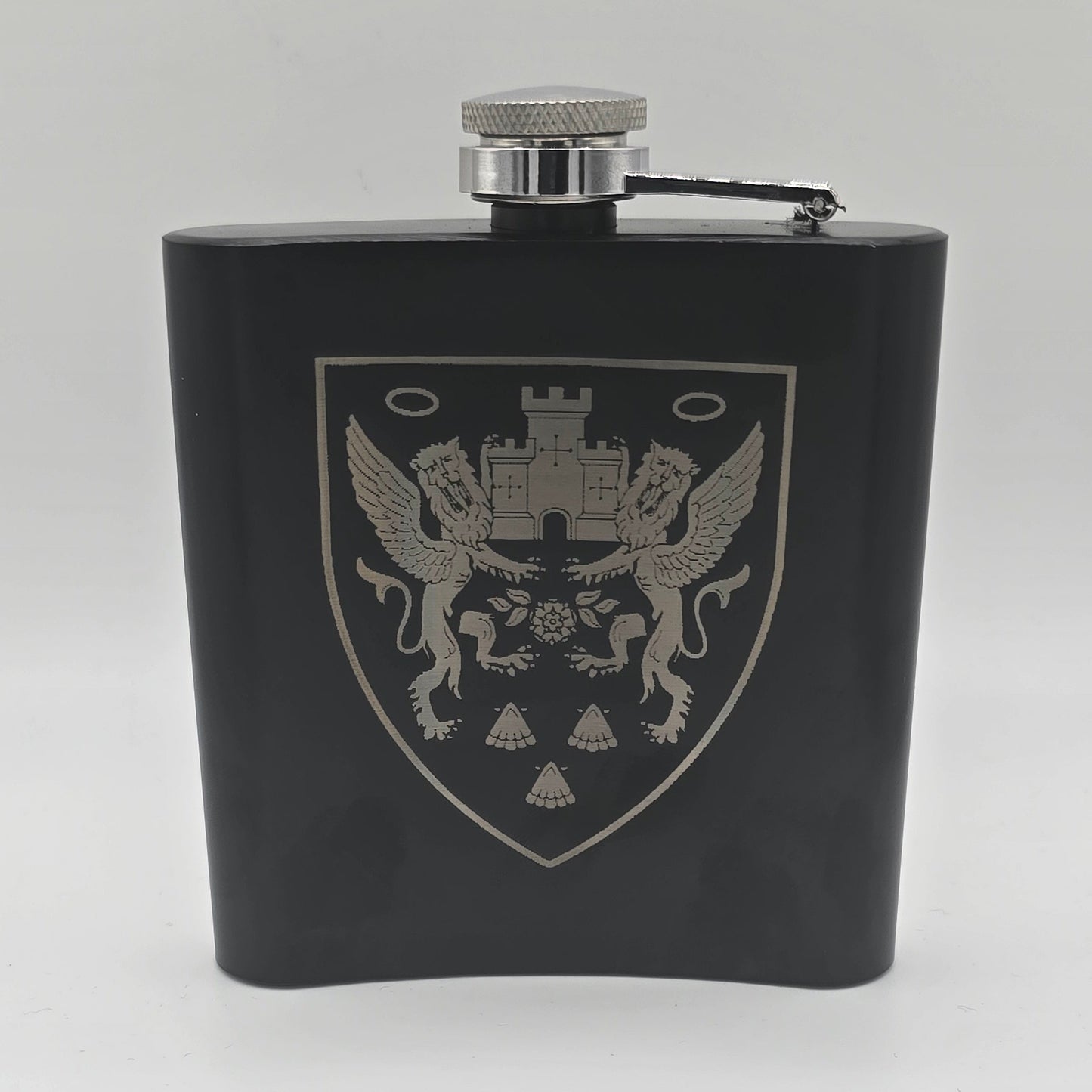 Black flask with a silver emblem on a white background