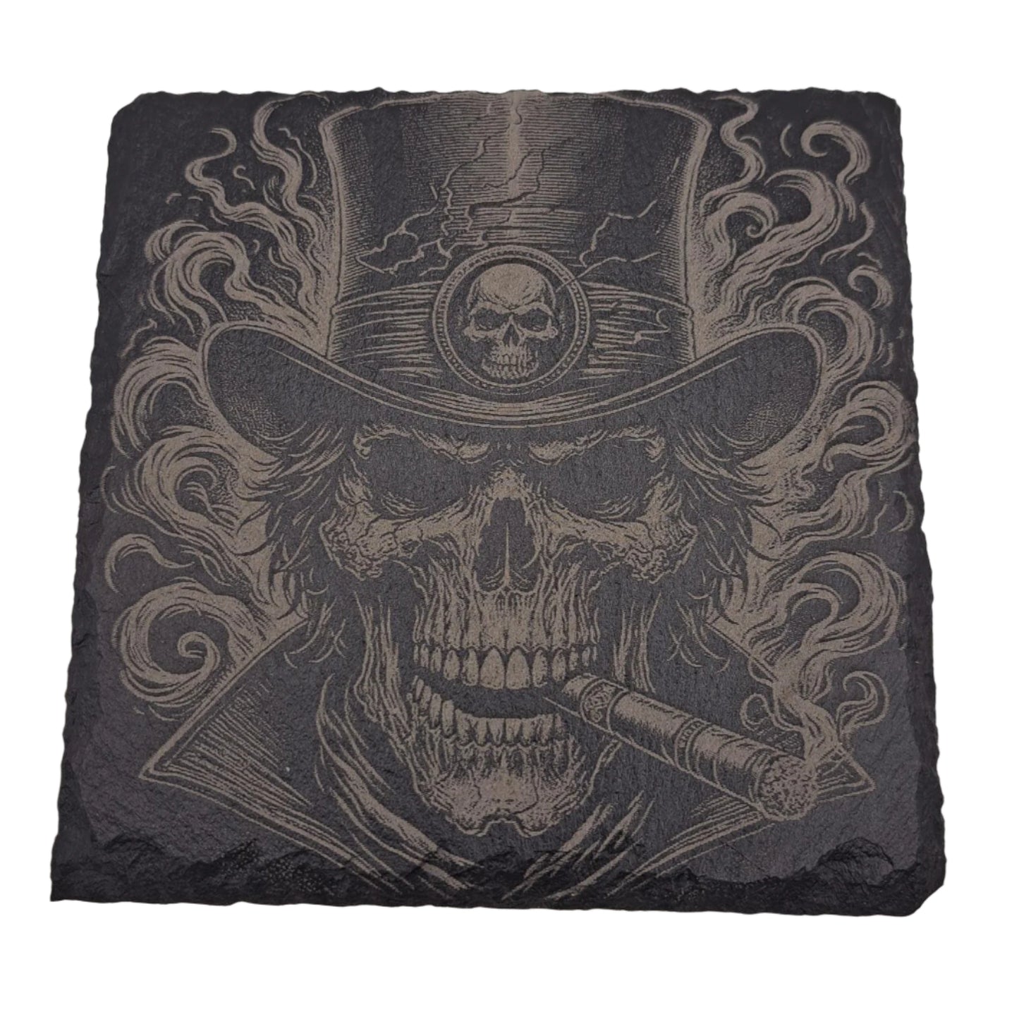 A beautifully etched slate coaster featuring a smoking skull