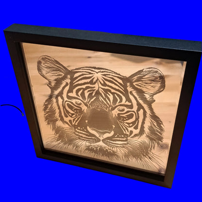 Brighten your space with this LED Lightbox Mirror, featuring a stunning tiger image and vibrant multi-color LED lights. Perfect for adding a unique touch to any room, this stylish mirror is as functional as it is eye-catching.

Key Features
🐅 Stunning Tiger Design: A bold centerpiece for your wall or desk.
🌈 Multi-Color LED Lights: Choose from a variety of colors to suit your mood or style.
🎛 3-Button Control Pad: Effortlessly switch between settings, including Flash, Fade, and Constant.
🖤 Sleek Black F