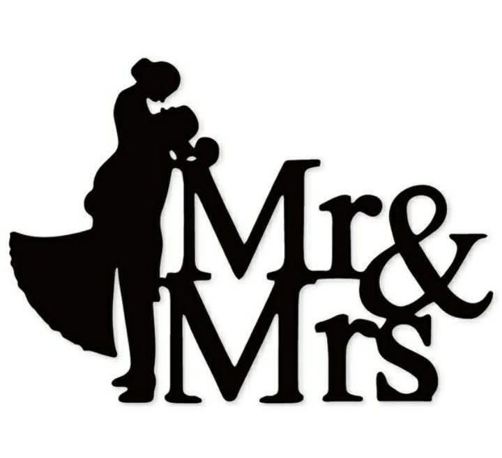 Black metal wedding cake topper featuring a silhouette of a bride and groom embracing, with the words 'Mr & Mrs' in elegant serif lettering, shown on a plain white background.
