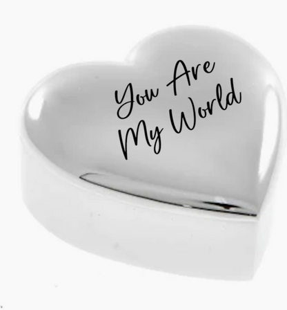 Heart-shaped object with 'You Are My World' text on a white background